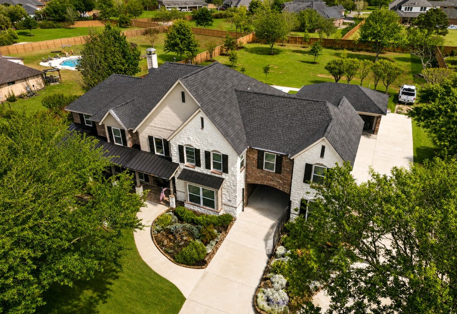 Clean stone and brick home exterior from above